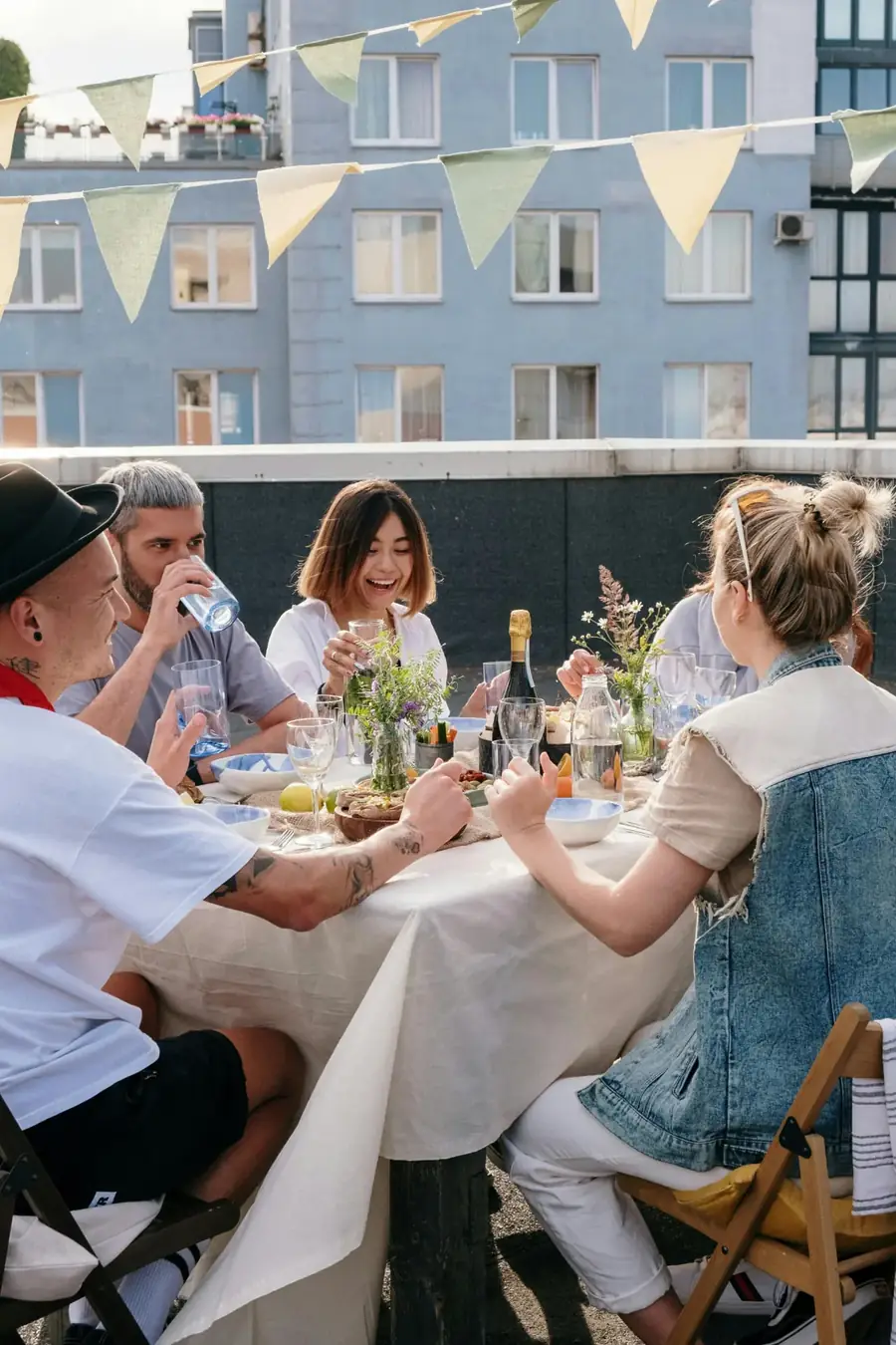 Friends gathered around a table for a hosted dinner