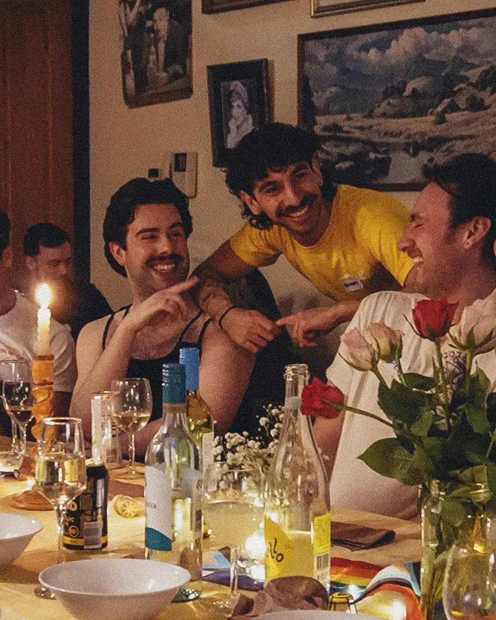 Members laughing over dinner at a club event
